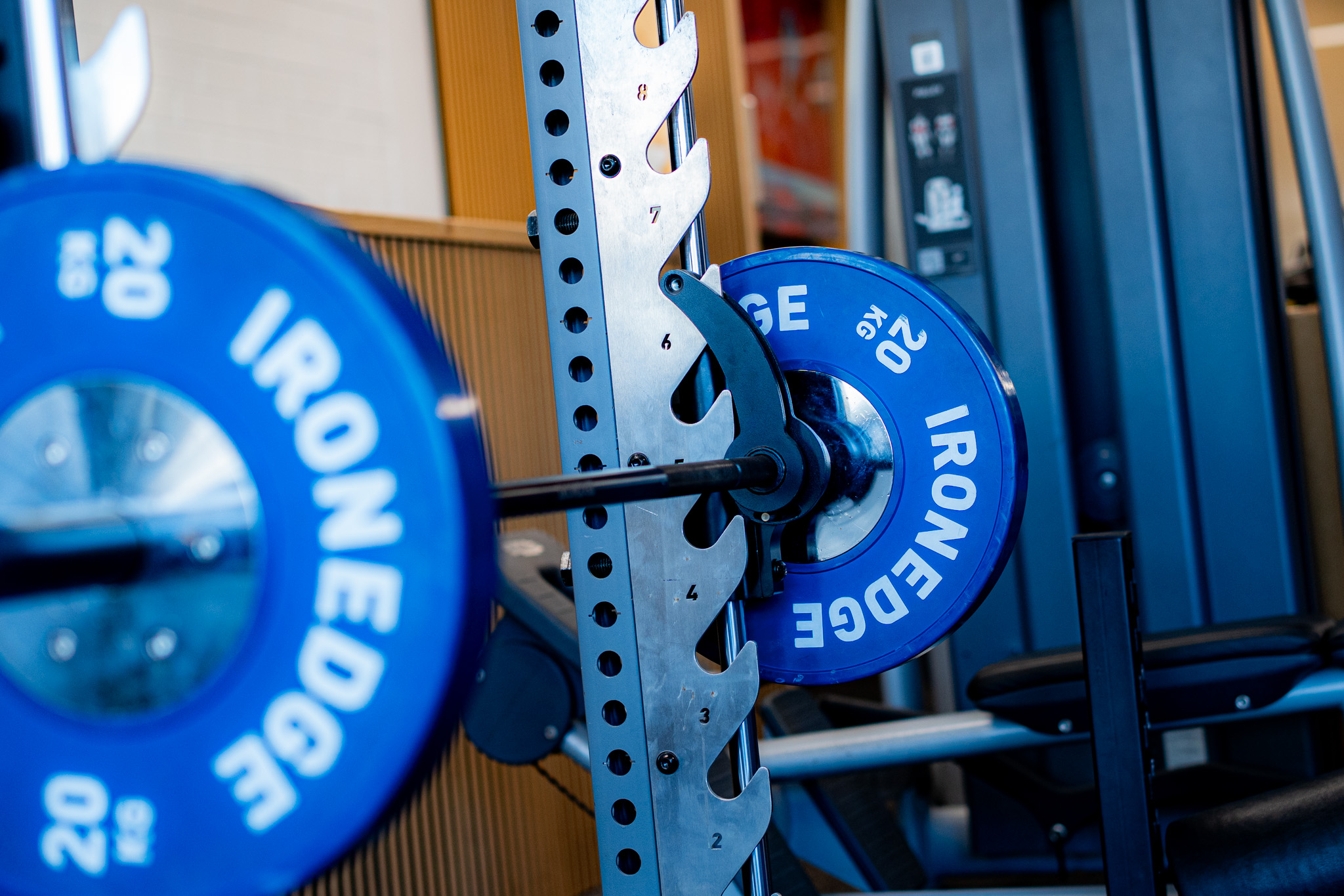 IronEdge Olympic weight plates on a rack